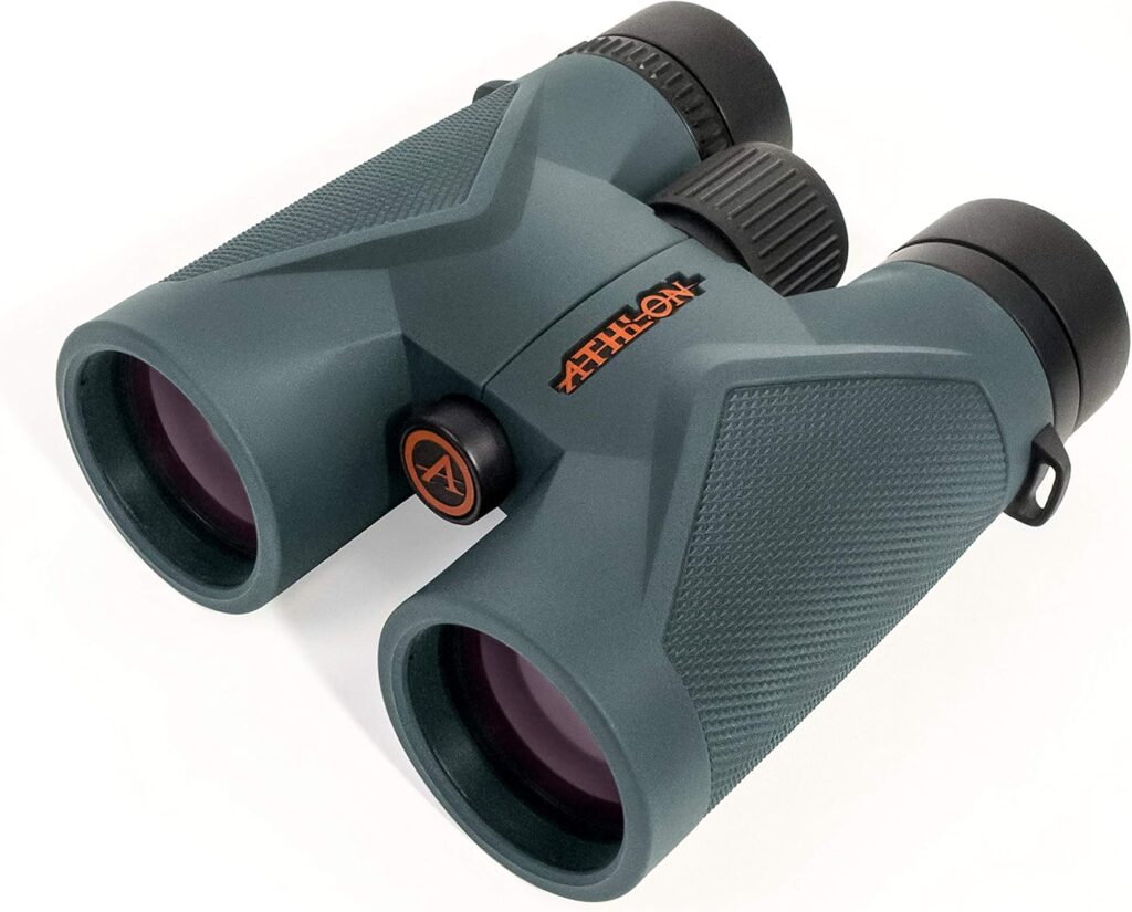 a pair of binoculars with black and orange lenses